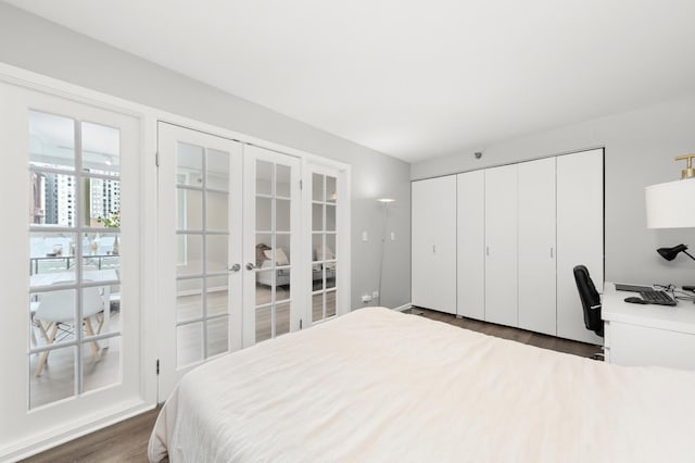 345 N La Salle Dr Unit 1205, Chicago, IL 60610 - bedroom featuring french doors, dark wood-type flooring, and a closet