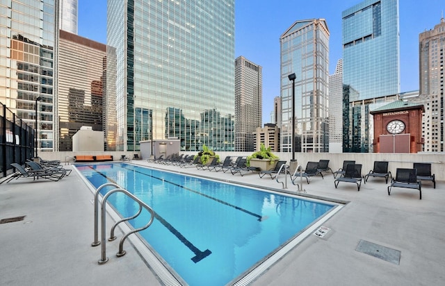 345 N La Salle Dr Unit 1205, Chicago, IL 60610 - pool with a patio area and a city view