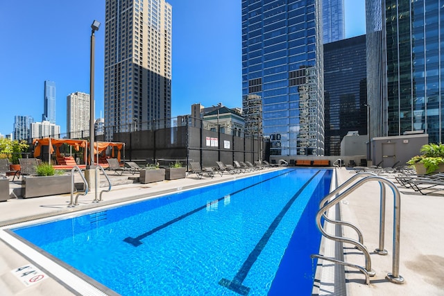 345 N La Salle Dr Unit 1205, Chicago, IL 60610 - community pool with fence, a view of city, and a patio