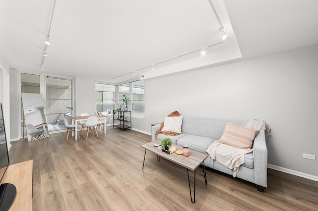 345 N La Salle Dr Unit 1205, Chicago, IL 60610 - living area featuring track lighting, baseboards, and wood finished floors
