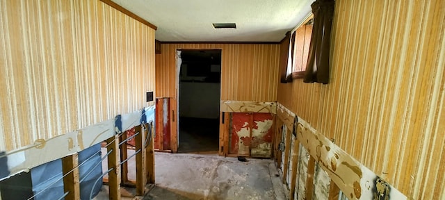 corridor featuring visible vents and concrete flooring
