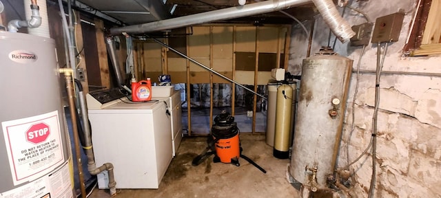 interior space featuring water heater and separate washer and dryer