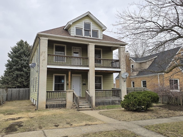 view of front of home featuring a porch, a shingled roof, fence, and a balcony