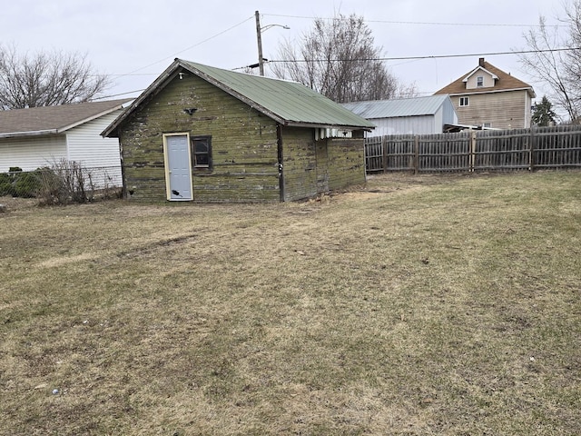 view of outdoor structure featuring a fenced backyard