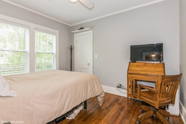 bedroom featuring dark wood-type flooring, baseboards, a ceiling fan, and ornamental molding