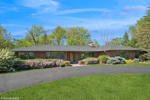 1050 Cedar Ln, Lake Forest, IL 60045 - single story home featuring brick siding, a chimney, and a front lawn