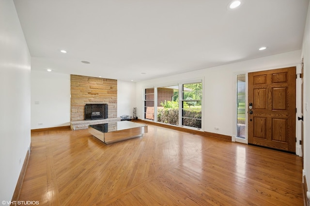 1050 Cedar Ln, Lake Forest, IL 60045 - unfurnished living room featuring baseboards, a fireplace, light wood finished floors, and recessed lighting