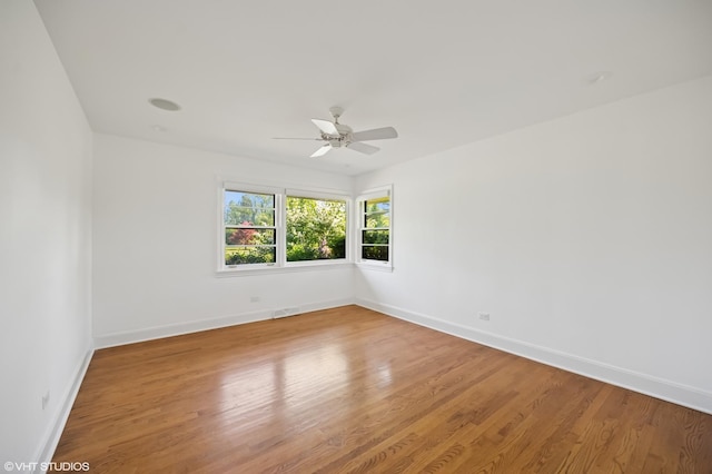 1050 Cedar Ln, Lake Forest, IL 60045 - spare room with light wood-type flooring, a ceiling fan, and baseboards
