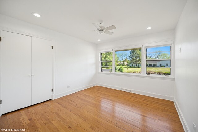 1050 Cedar Ln, Lake Forest, IL 60045 - unfurnished bedroom with baseboards, light wood-type flooring, recessed lighting, ceiling fan, and a closet