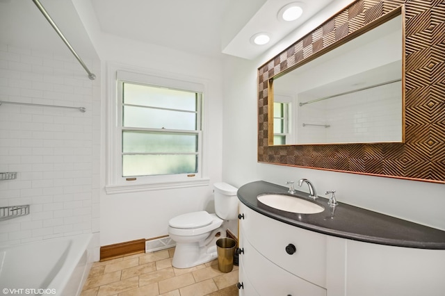 1050 Cedar Ln, Lake Forest, IL 60045 - bathroom featuring vanity, toilet, baseboards,  shower combination, and tile patterned flooring