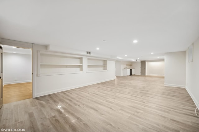 1050 Cedar Ln, Lake Forest, IL 60045 - finished basement with light wood-style flooring, baseboards, and recessed lighting