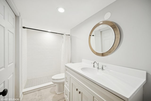 1050 Cedar Ln, Lake Forest, IL 60045 - bathroom with vanity, a tile shower, toilet, and recessed lighting