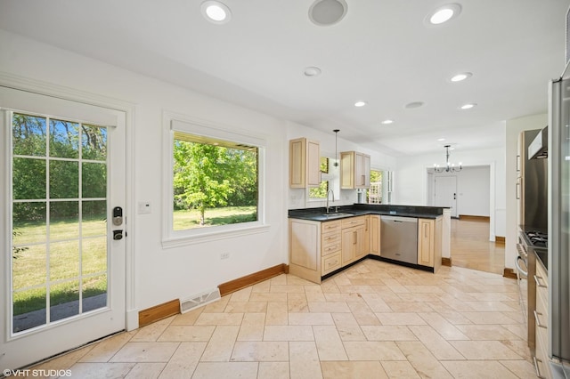 1050 Cedar Ln, Lake Forest, IL 60045 - kitchen with stainless steel dishwasher, a sink, a peninsula, a chandelier, and light brown cabinets