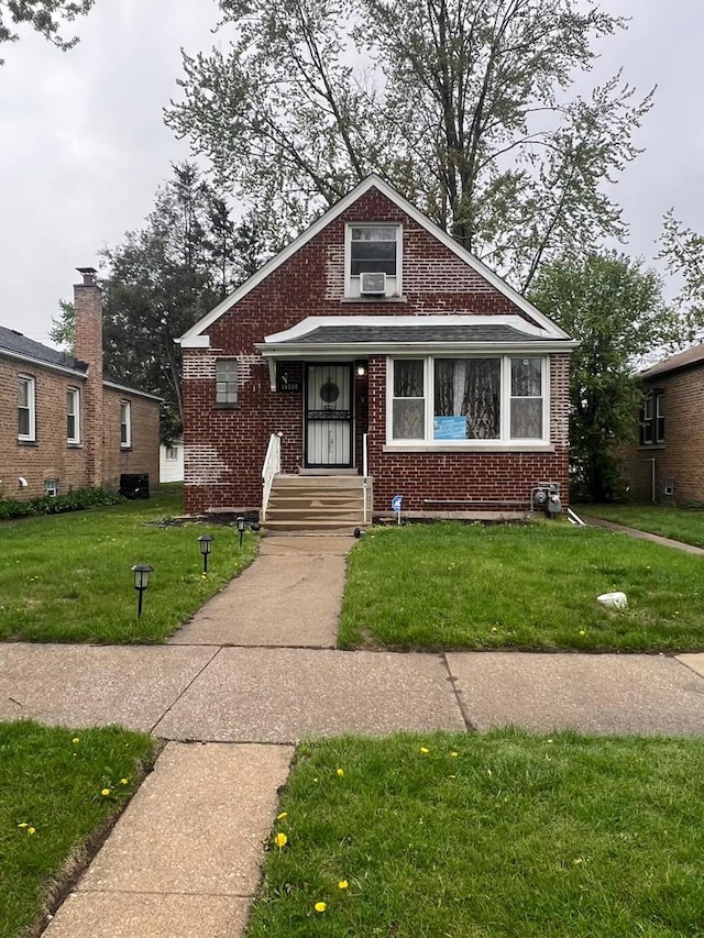 14534 S Grant St, Dolton, IL 60419 - bungalow with brick siding and a front yard