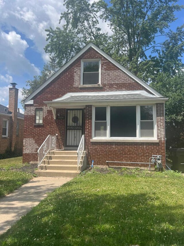 14534 S Grant St, Dolton, IL 60419 - bungalow featuring brick siding and a front lawn