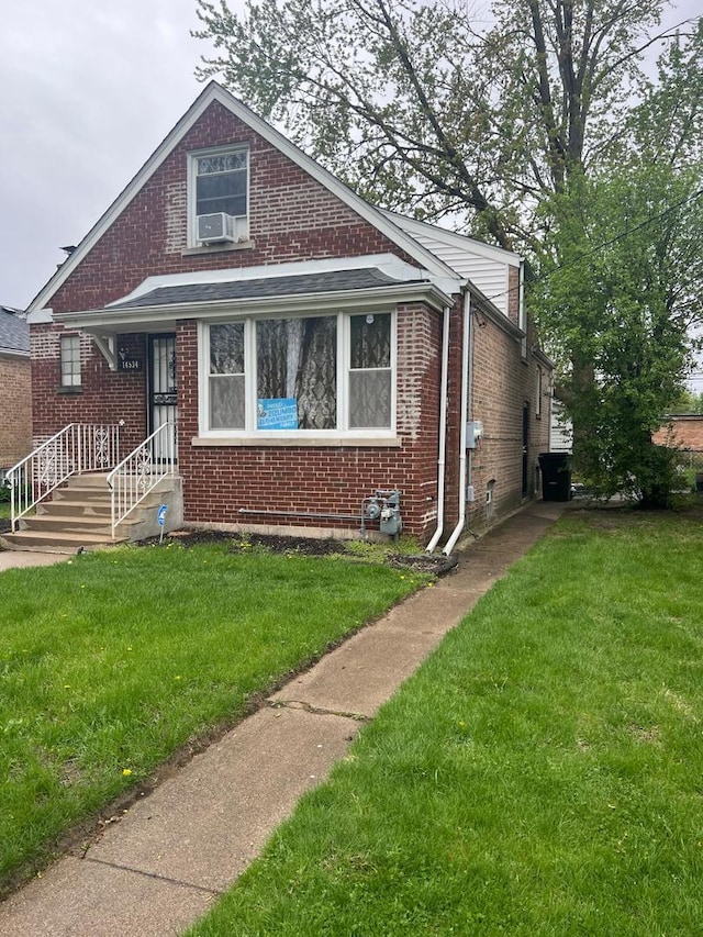 14534 S Grant St, Dolton, IL 60419 - bungalow-style house featuring a front yard and brick siding