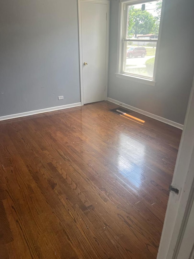 14534 S Grant St, Dolton, IL 60419 - unfurnished room featuring dark wood finished floors