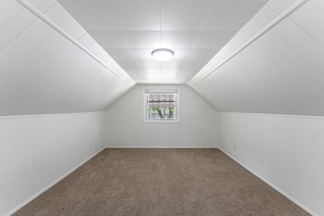 bonus room with baseboards, carpet floors, and vaulted ceiling