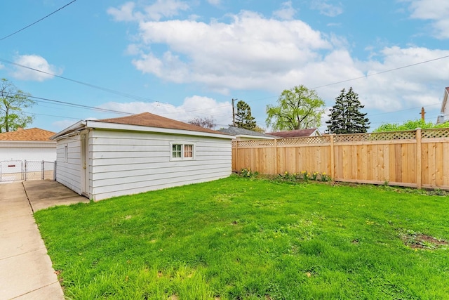 view of yard featuring an outdoor structure and fence