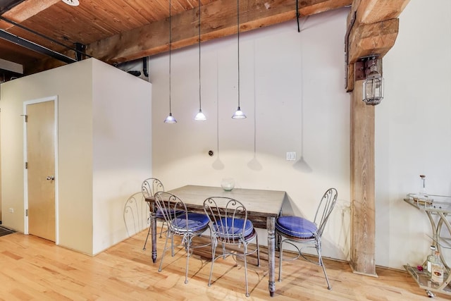 dining area with wood finished floors