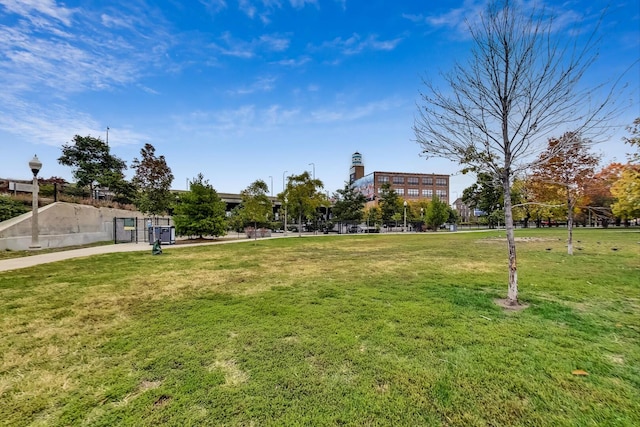 view of property's community with a lawn