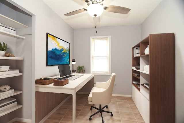 home office with baseboards and ceiling fan