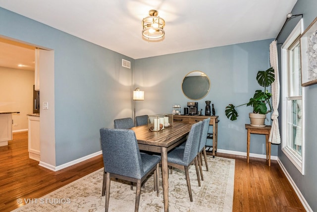 1057 Ponca Dr, Batavia, IL 60510 - dining room with wood finished floors and baseboards