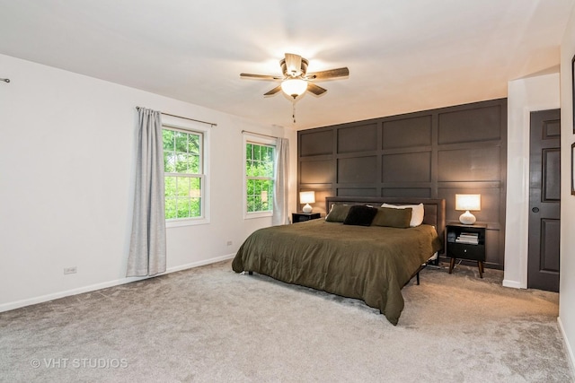 1057 Ponca Dr, Batavia, IL 60510 - carpeted bedroom featuring a decorative wall, baseboards, and a ceiling fan