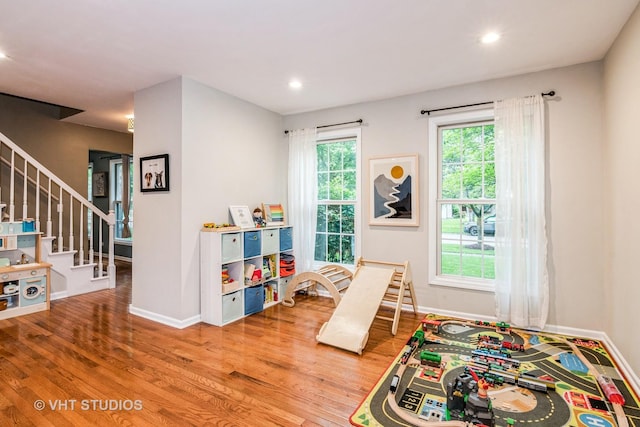 1057 Ponca Dr, Batavia, IL 60510 - rec room with wood finished floors, baseboards, and recessed lighting
