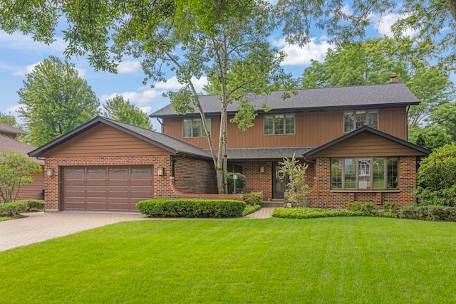 22W281 Mccarron Rd, Glen Ellyn, IL 60137 - view of front of house with an attached garage, decorative driveway, a front lawn, and roof with shingles
