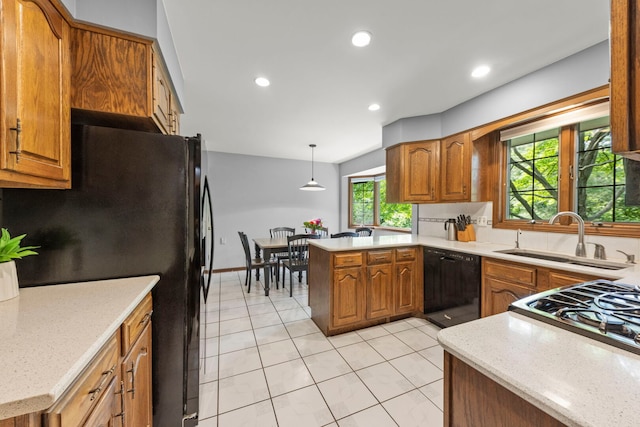 22W281 Mccarron Rd, Glen Ellyn, IL 60137 - kitchen with black appliances, a peninsula, brown cabinetry, light tile patterned flooring, and recessed lighting
