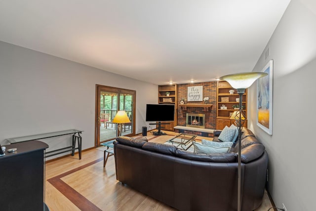 22W281 Mccarron Rd, Glen Ellyn, IL 60137 - living area with built in features, a fireplace, and light wood-style flooring