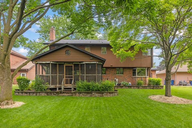 22W281 Mccarron Rd, Glen Ellyn, IL 60137 - back of property with a yard, brick siding, a chimney, and a sunroom