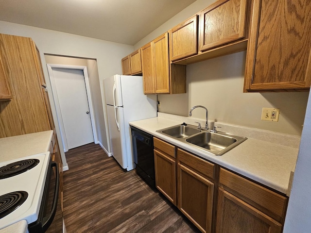 kitchen featuring dark wood-style flooring, black dishwasher, electric stove, light countertops, and a sink