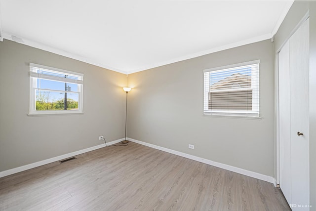 16165 Haven Ave, Orland Hills, IL 60487 - unfurnished room with plenty of natural light, wood finished floors, baseboards, and ornamental molding