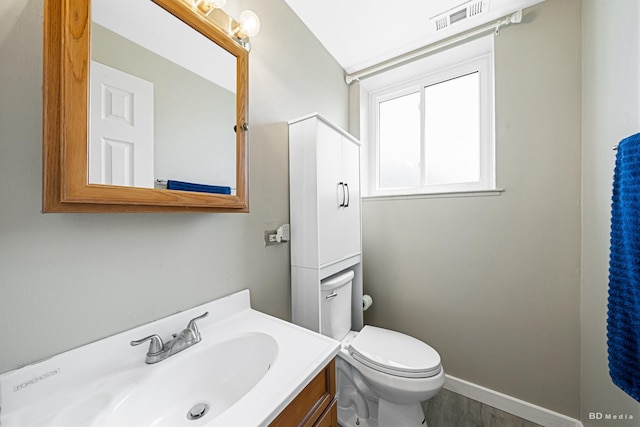 16165 Haven Ave, Orland Hills, IL 60487 - bathroom with vanity, toilet, baseboards, and wood finished floors