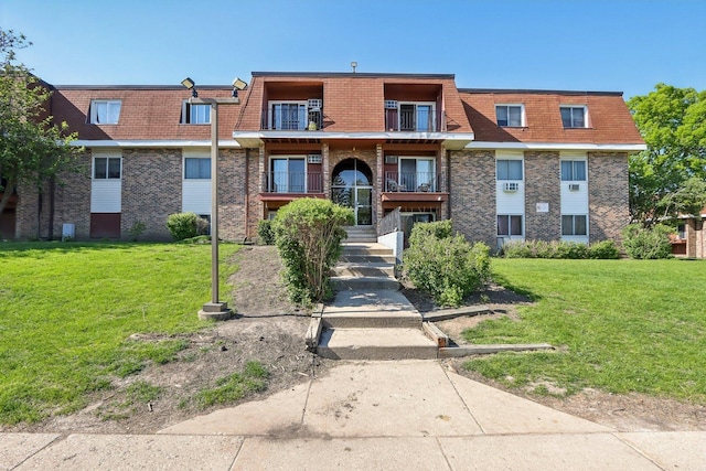 600 Mesa Dr Unit 103, Hoffman Estates, IL 60169 - multi unit property with brick siding, mansard roof, and a front lawn