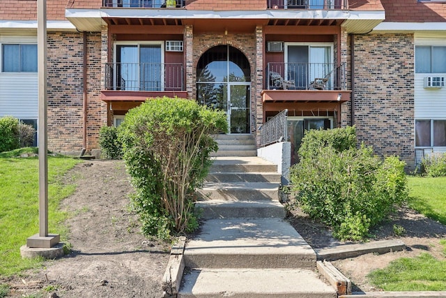 600 Mesa Dr Unit 103, Hoffman Estates, IL 60169 - property entrance with brick siding and a balcony