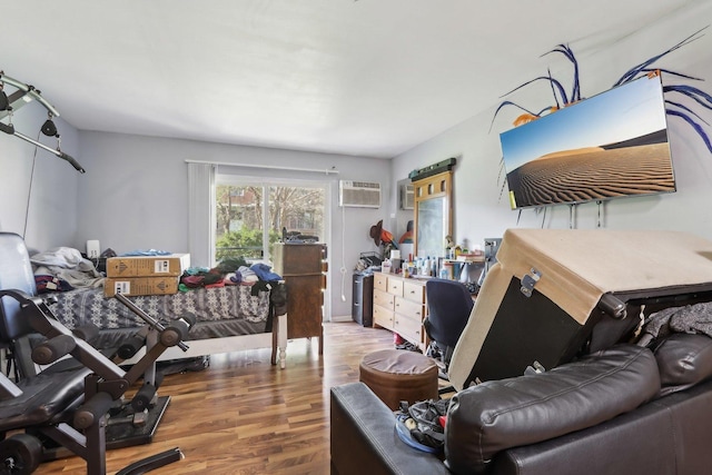 600 Mesa Dr Unit 103, Hoffman Estates, IL 60169 - bedroom featuring wood finished floors and a wall unit AC