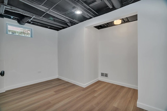 413 Wheeler Ave, Joliet, IL 60436 - basement with baseboards, visible vents, and wood finished floors