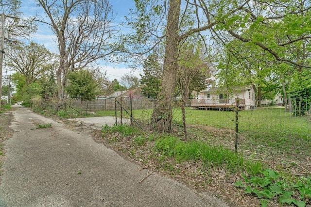 413 Wheeler Ave, Joliet, IL 60436 - view of yard featuring fence and a deck