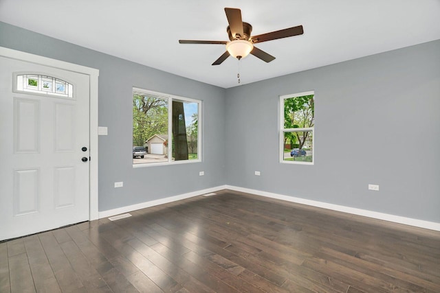 413 Wheeler Ave, Joliet, IL 60436 - entrance foyer with baseboards, a ceiling fan, dark wood finished floors, and visible vents