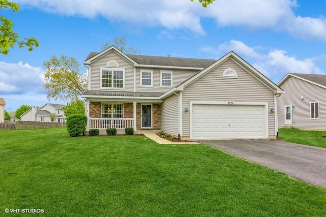 4524 Deames St, Plano, IL 60545 - traditional-style house with an attached garage, a porch, a front lawn, and aphalt driveway