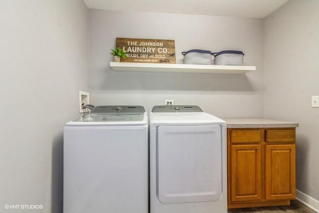 4524 Deames St, Plano, IL 60545 - laundry room with cabinet space, wood finished floors, and washer and dryer