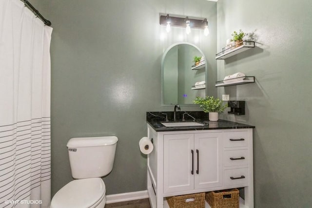 4524 Deames St, Plano, IL 60545 - bathroom with toilet, baseboards, curtained shower, and vanity