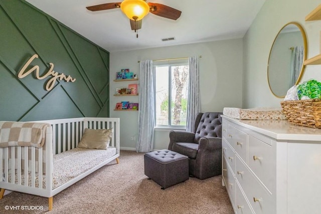 4524 Deames St, Plano, IL 60545 - bedroom featuring visible vents, ceiling fan, a nursery area, and light carpet
