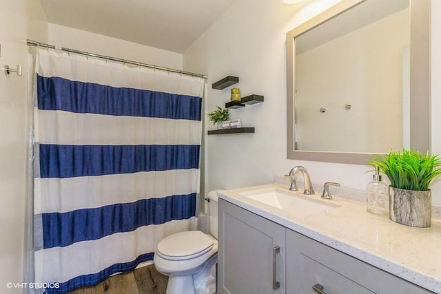 4524 Deames St, Plano, IL 60545 - full bath featuring toilet, a shower with curtain, wood finished floors, and vanity