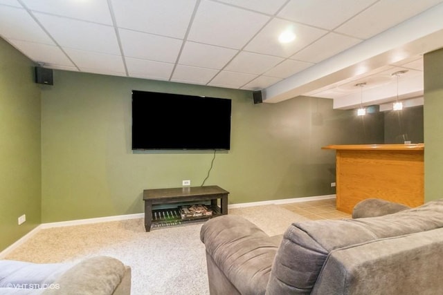 4524 Deames St, Plano, IL 60545 - carpeted living room with bar, baseboards, and a paneled ceiling