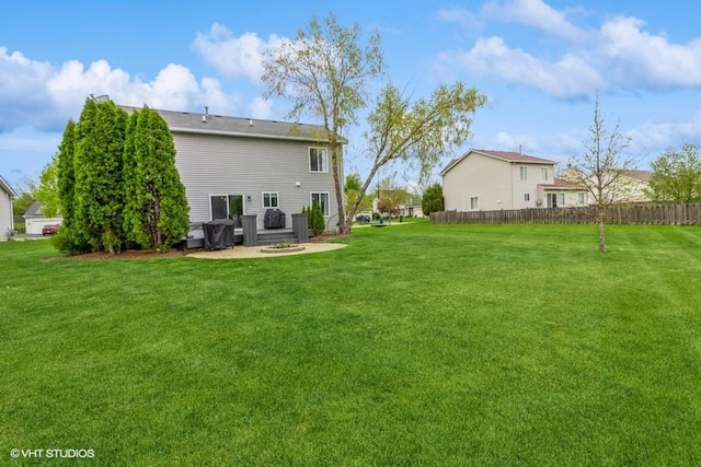 4524 Deames St, Plano, IL 60545 - back of property featuring a lawn, fence, and a patio area