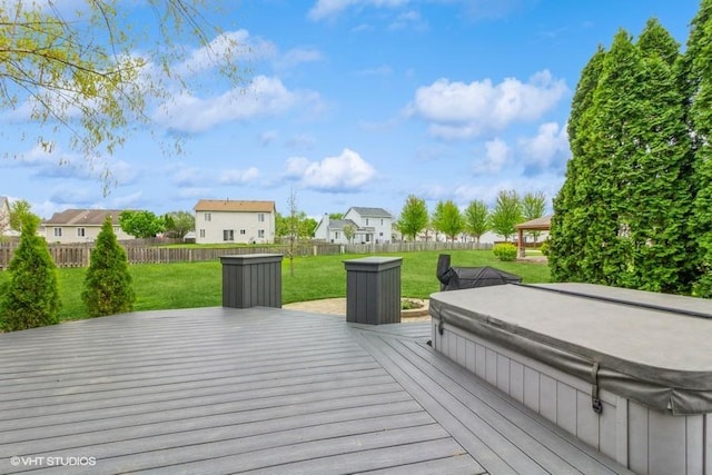 4524 Deames St, Plano, IL 60545 - deck featuring fence, a covered hot tub, a lawn, and a residential view